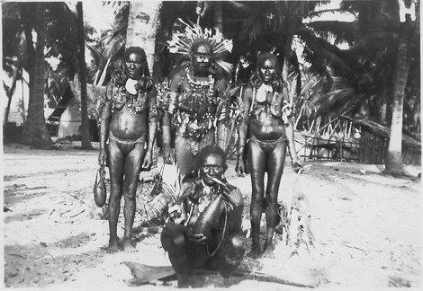 BD/115/2 -
Marind anim warrior surrounded by women