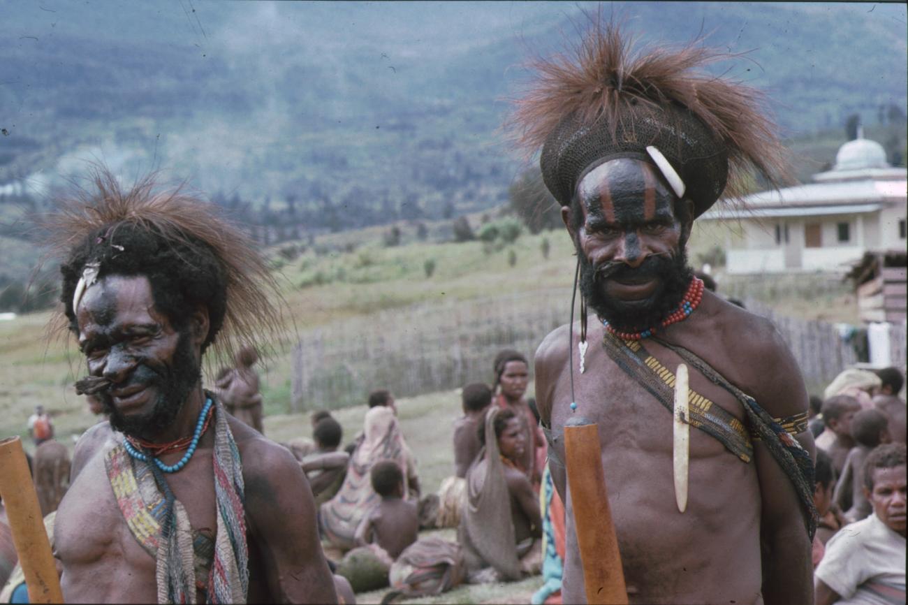 BD/166/123 -
Two men with feathers and black stripes on their faces