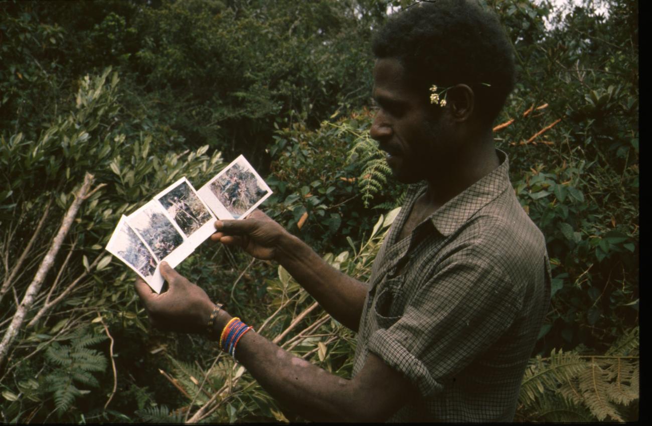 BD/166/12 -
Portrait of man with Polaroids