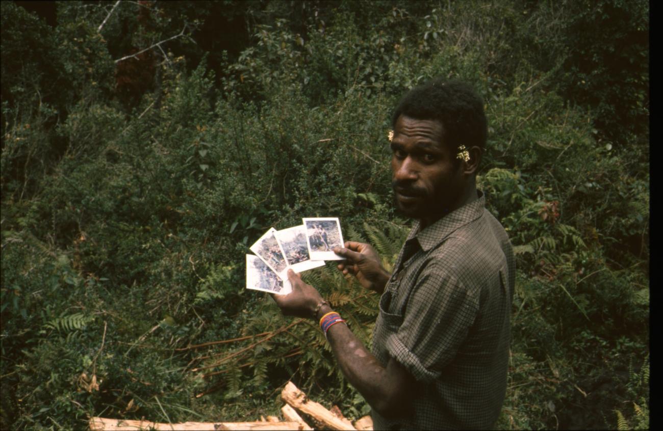 BD/166/12 -
Portrait of man with Polaroids