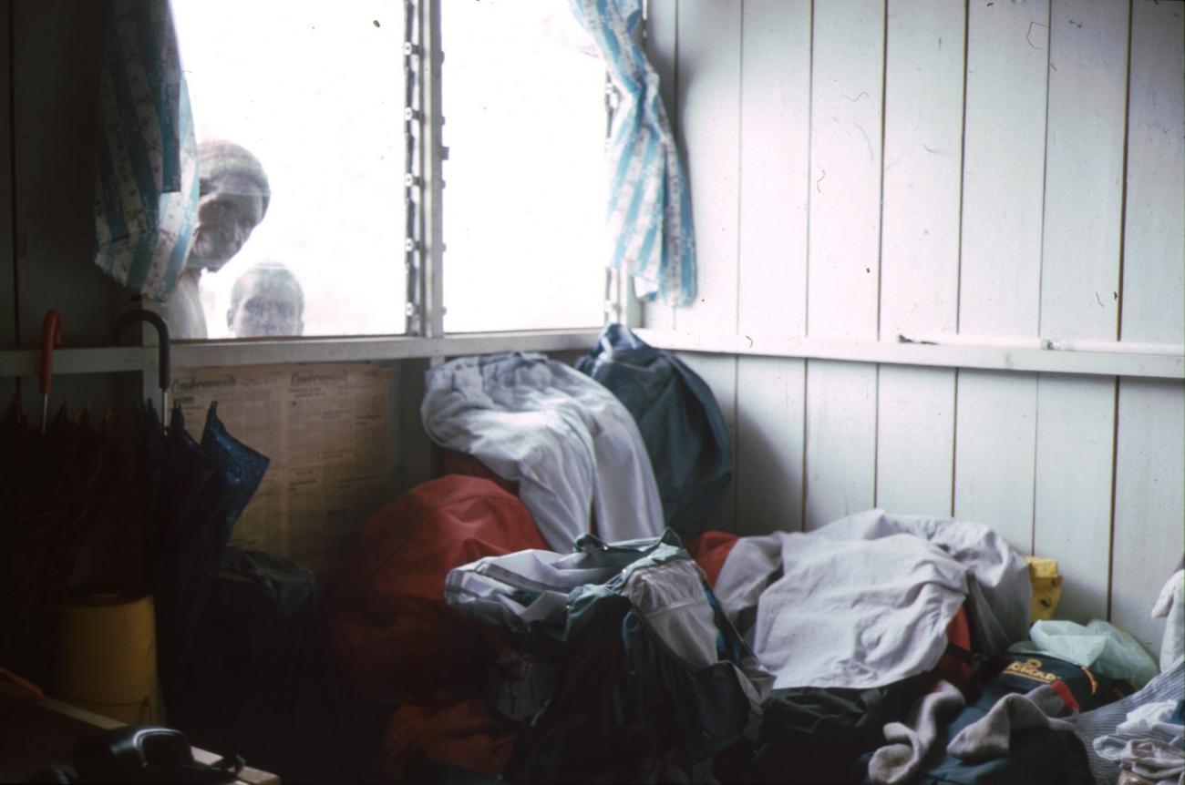BD/166/168 -
Pile of cloths in a hut