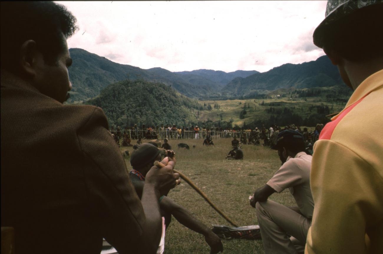 BD/166/200 -
Man in brown uniform points with a stick