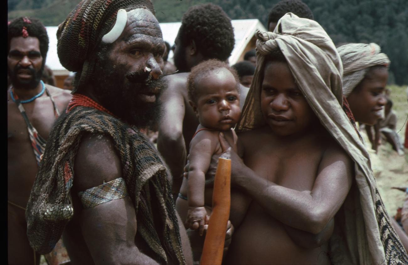 BD/166/50 -
Papuaman and woman in traditional dress with baby on her arm