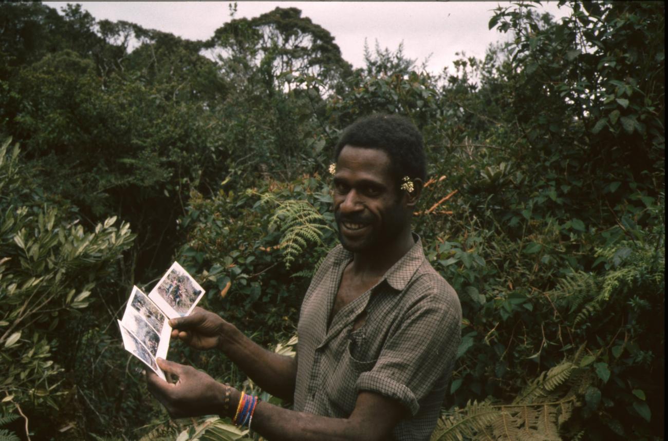 BD/166/8 -
Portrait of man with photographs