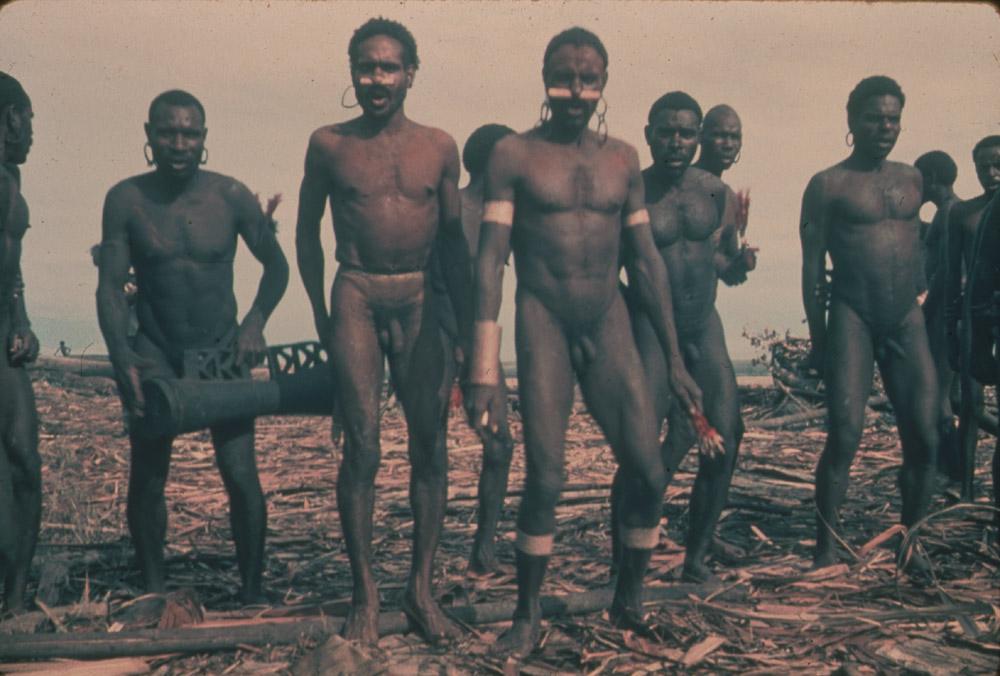 BD/30/52 -
Dancing Asmat people with one man playing the drum