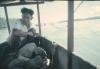 BD/144/641 Dieptepeilingen Jap. Foto man op schip met stenen