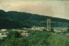 BD/67/163 Overzichtsopname gebouwen te Jayapura met elektriciteitsmast