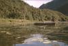 BD/132/14 landschap met man in kano, prauw en man in water