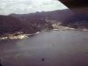 BD/66/50 Luchtfoto van huizen en fabrieken bij een baai