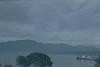 BD/171/523 Schip op zee met bergen op achtergrond