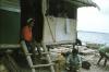 BD/171/738 Man met huis aan meer